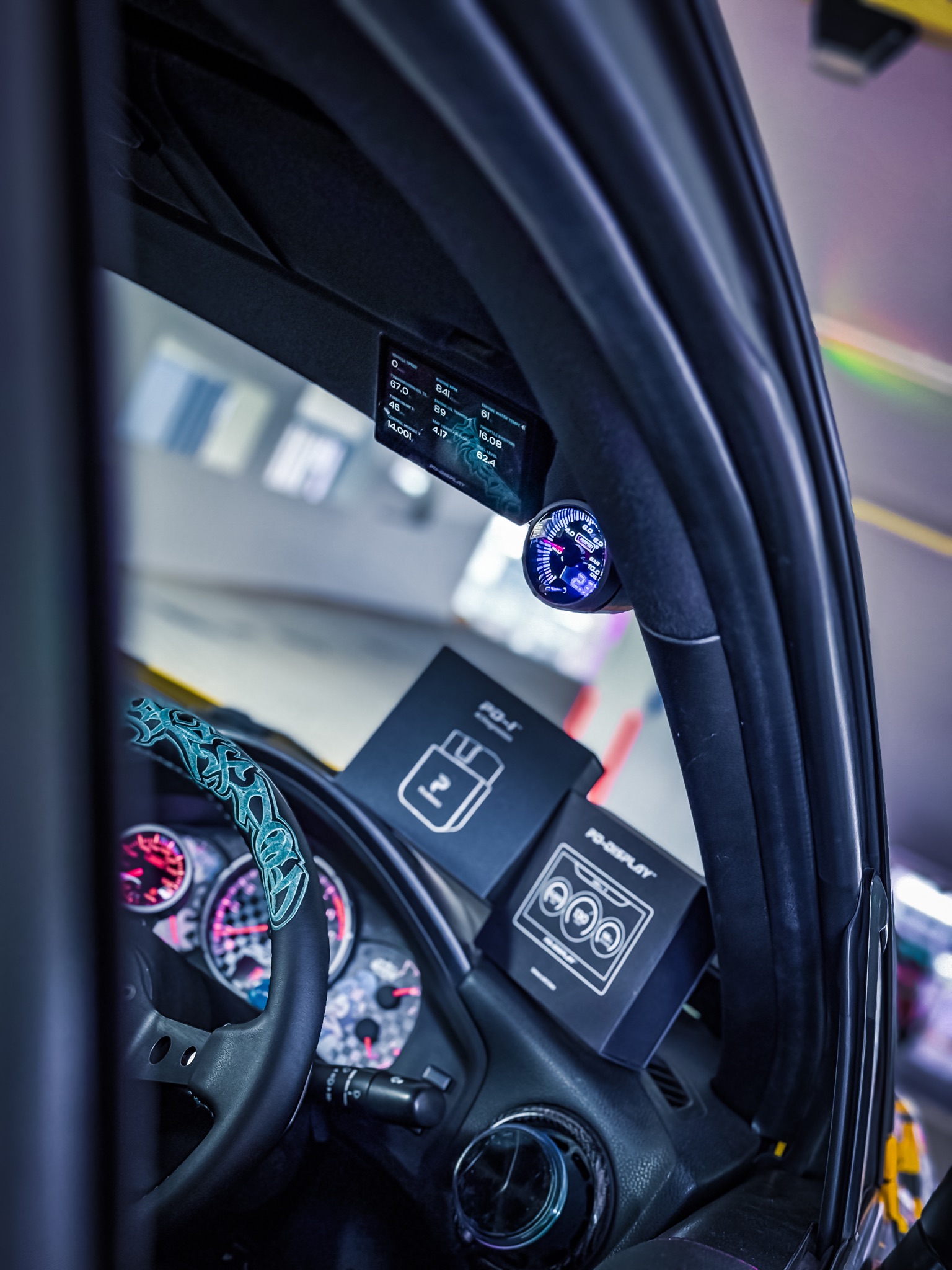 PD-Display installation near the car’s A-pillar with PD-1 and PD-Display packaging